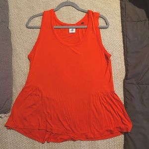 Reddish-orange tank top with peplum detail by Cabi